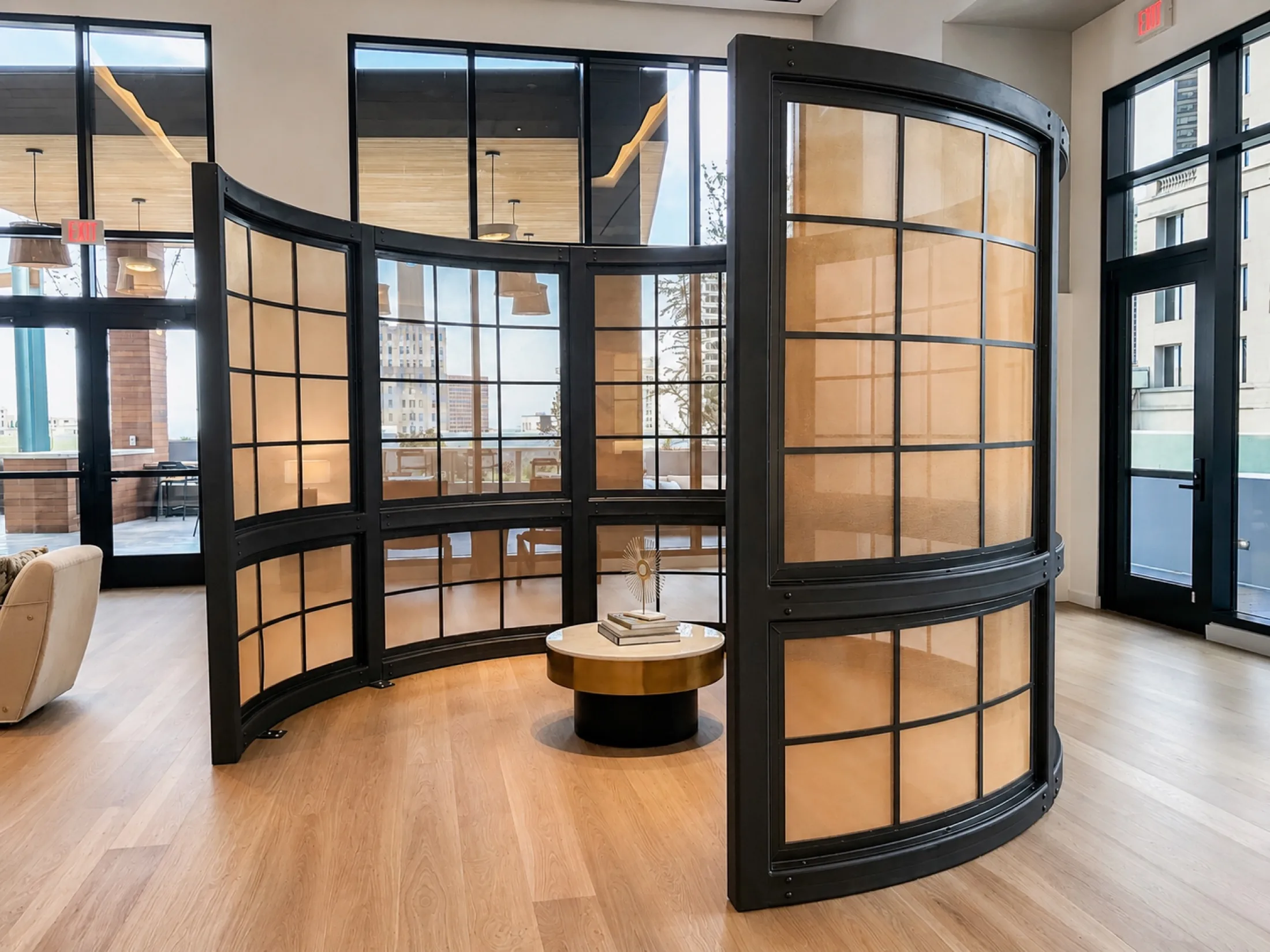 Curved architectural doors and glass partitions in a finished interior
