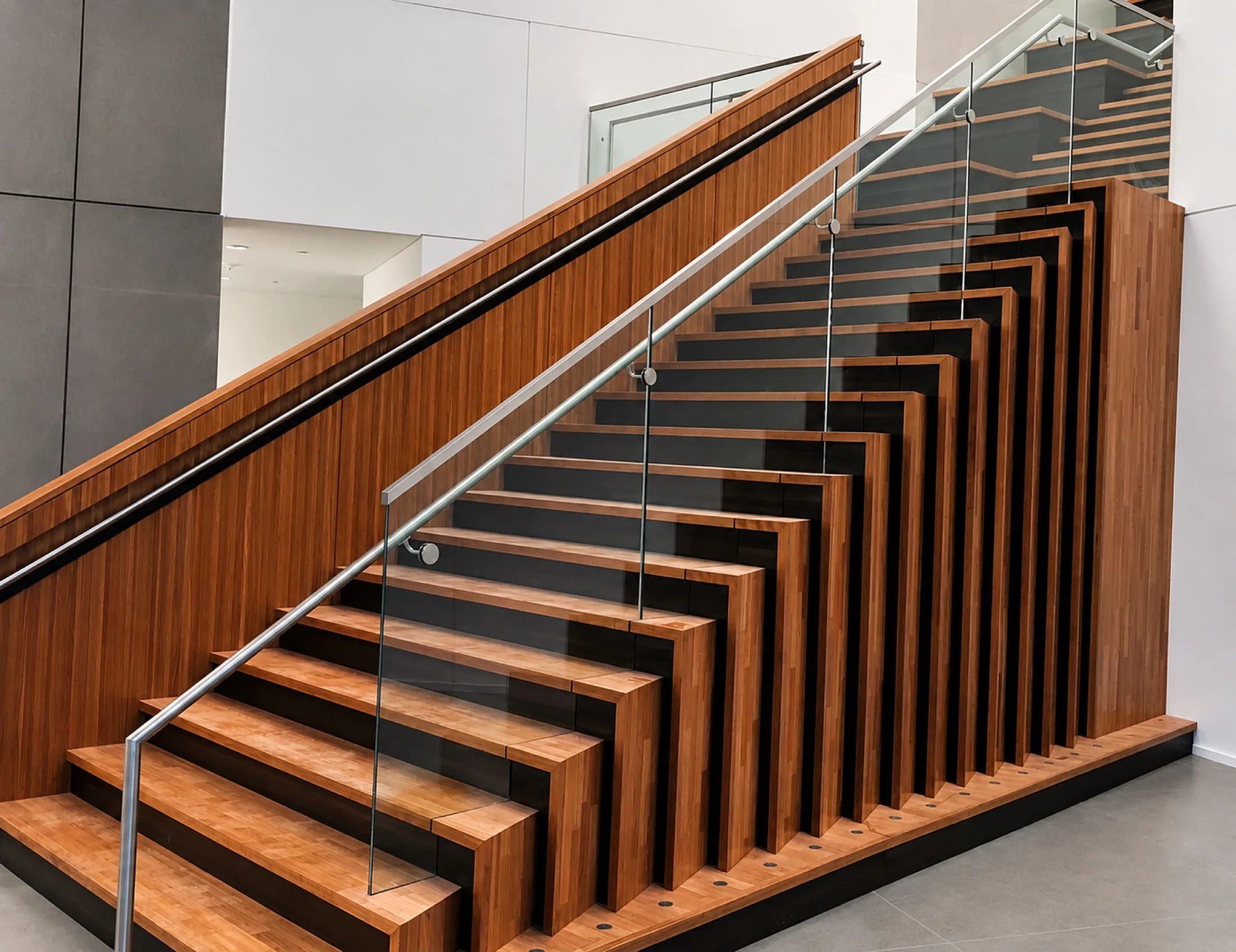 Custom Architectural woodwork surrounding a commercial staircase