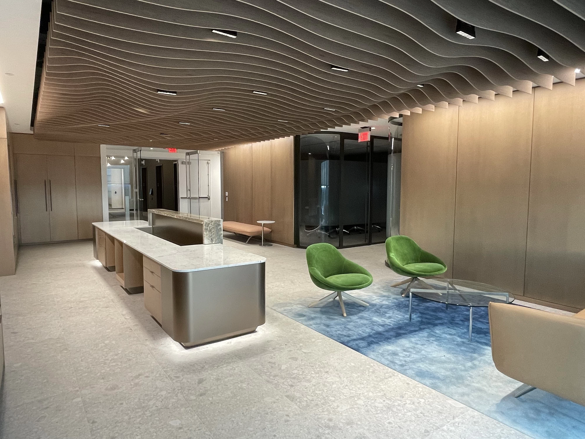 Custom millwork and glass offices in a finished commercial interior